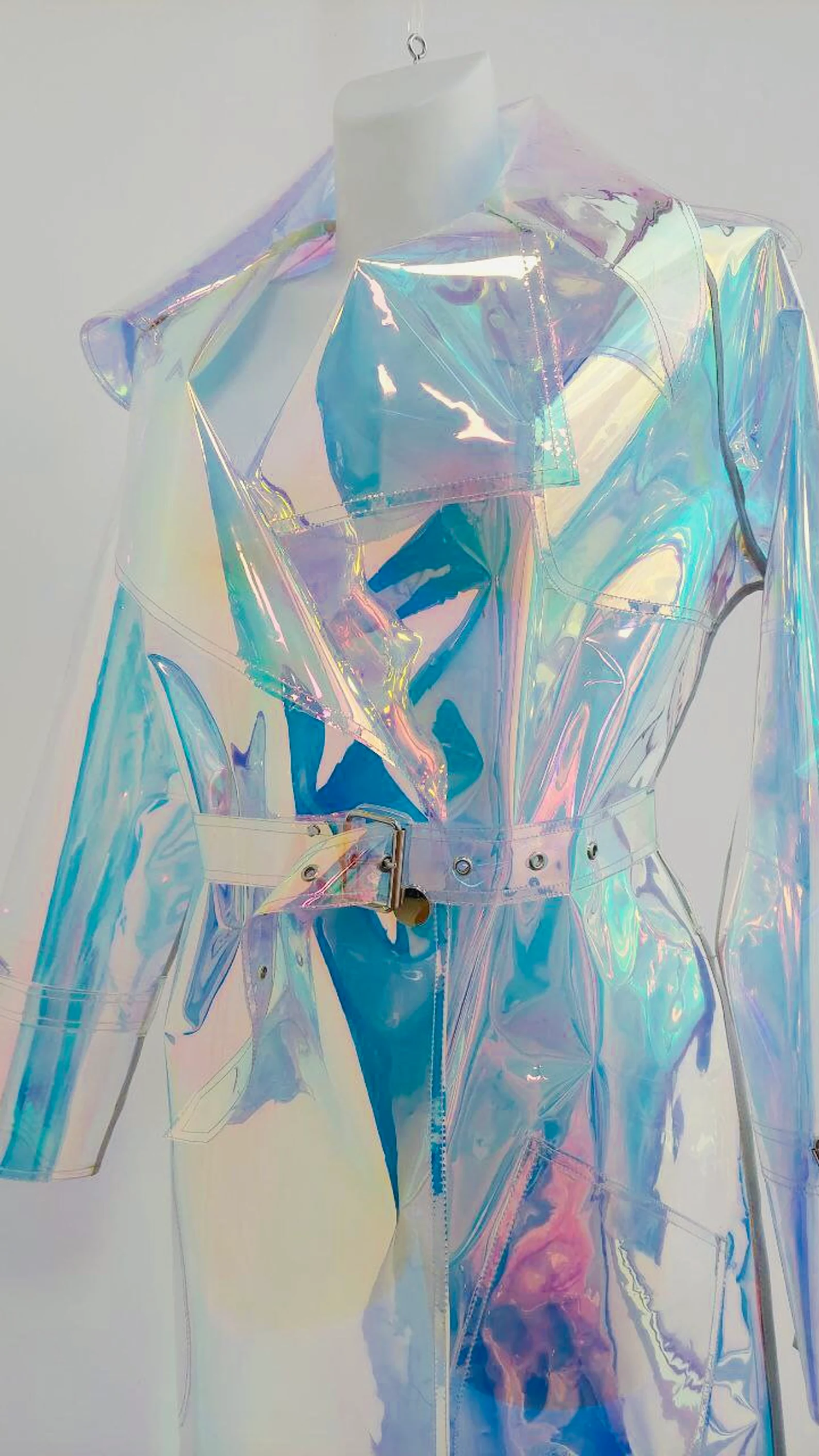 Close-up of glossy iridescent TPU material on a futuristic men's coat.