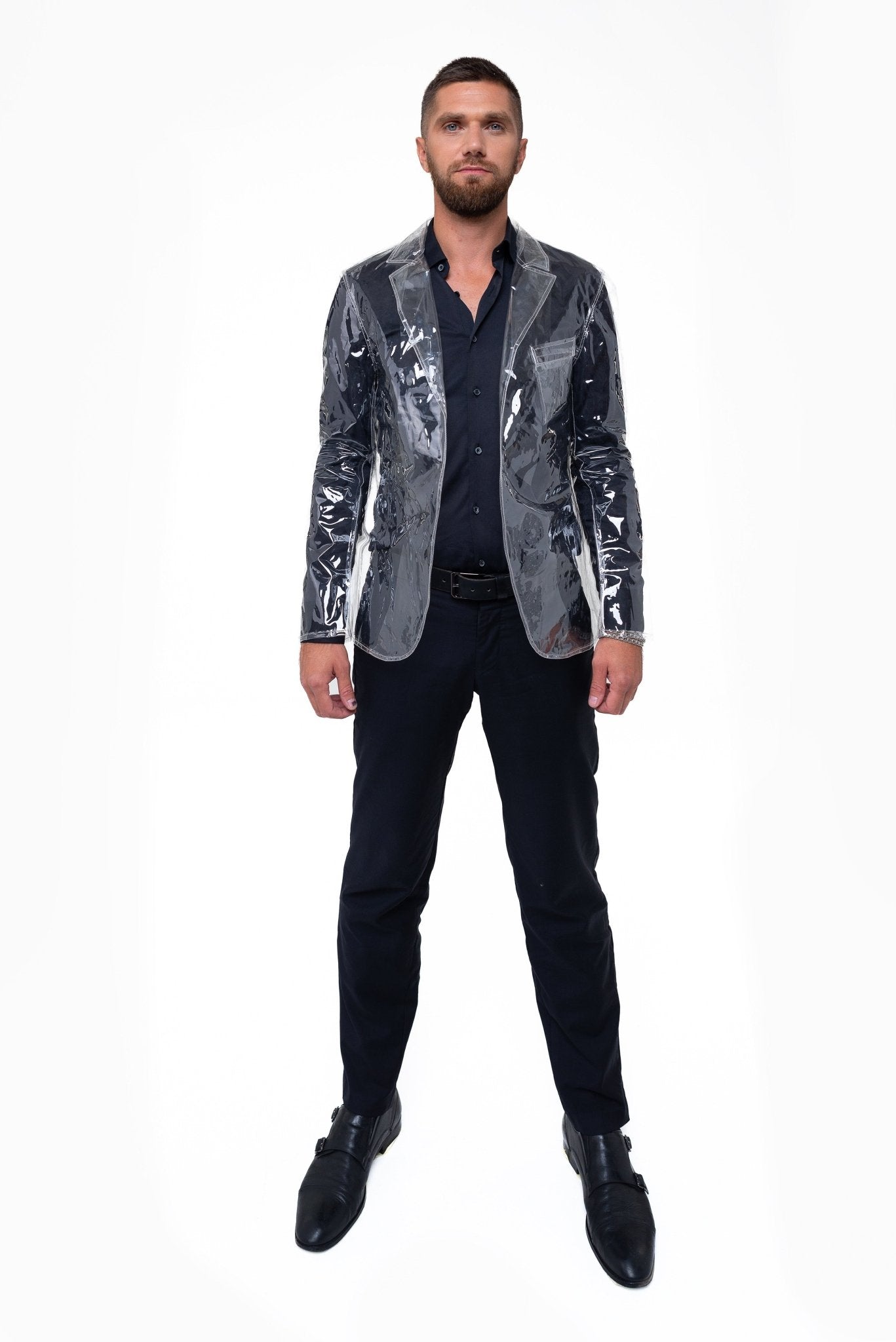 Close-up of the high-gloss material and lapels on a men's transparent blazer.