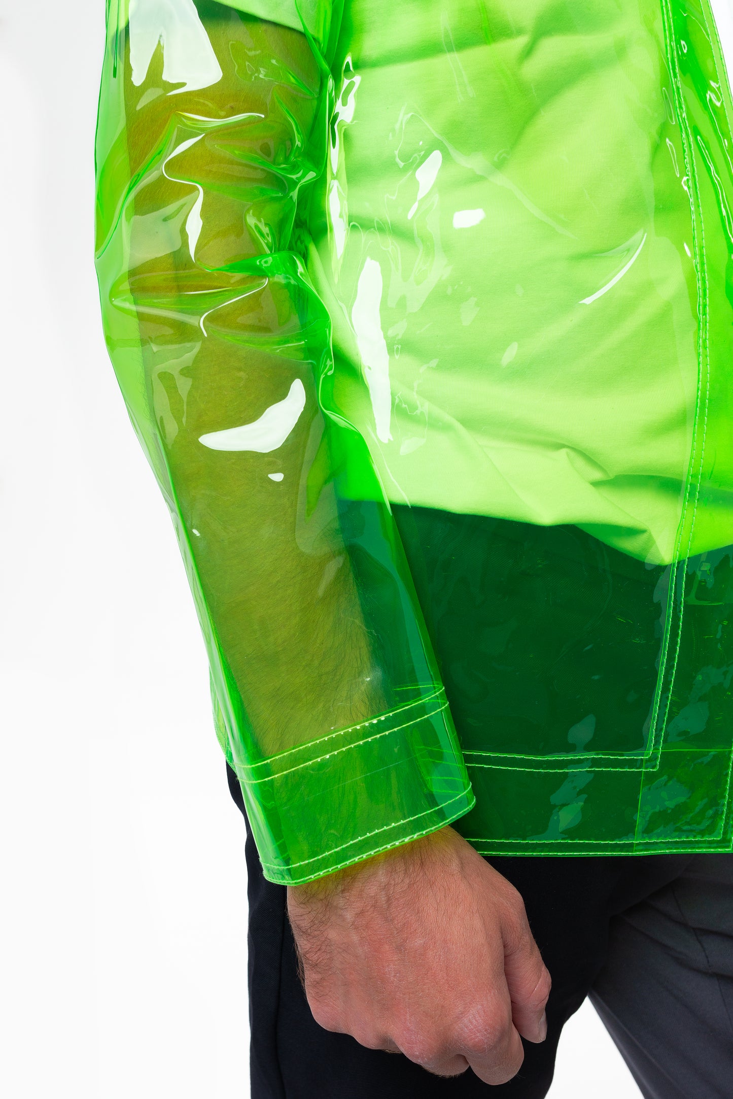 sleeve details of a transparent neon green blazer