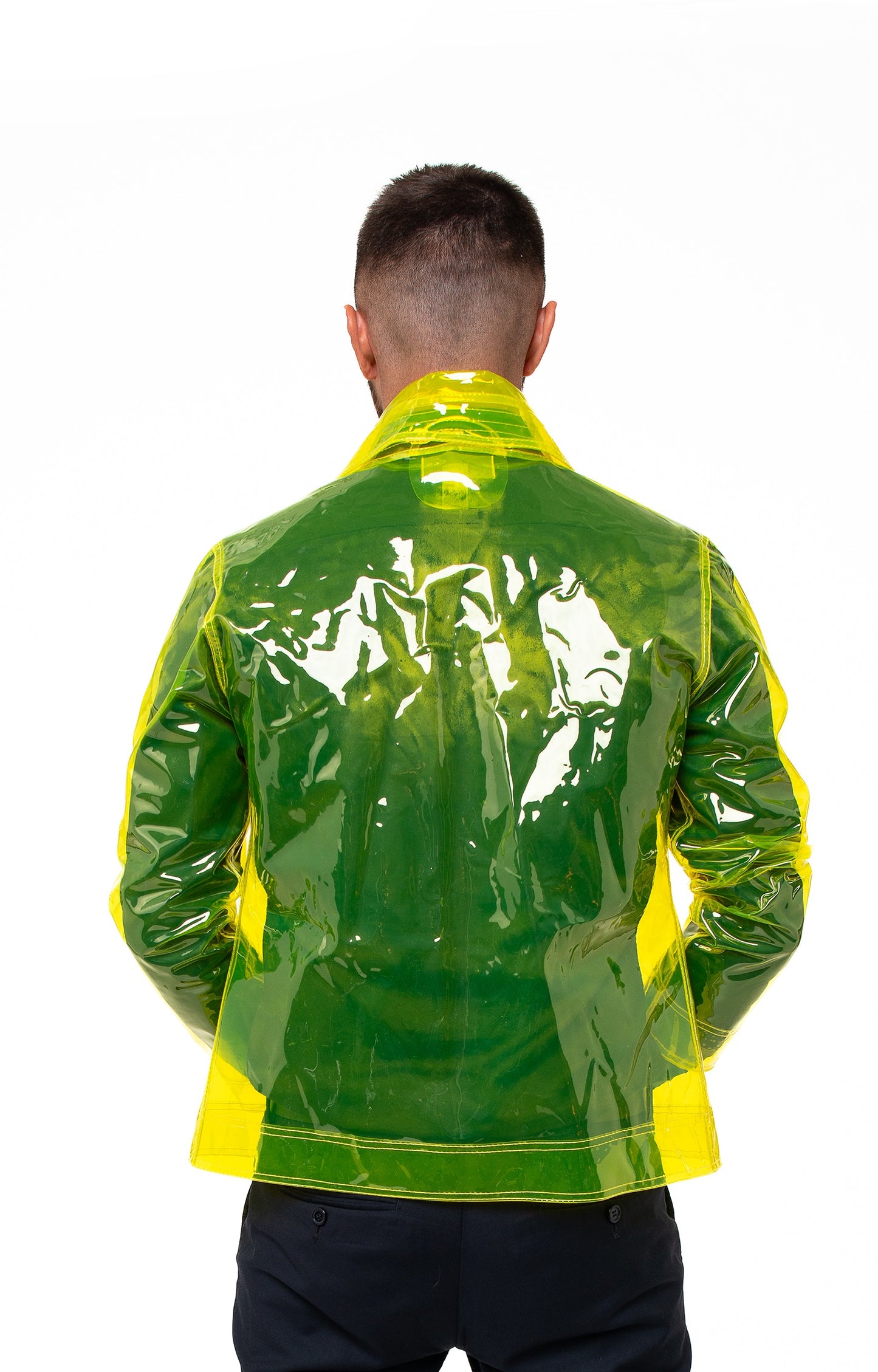 Close-up of flexible glossy transparent material on a yellow vinyl mens blazer