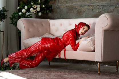Avant-garde accessory styling featuring the transparent vinyl head wrap with red suite