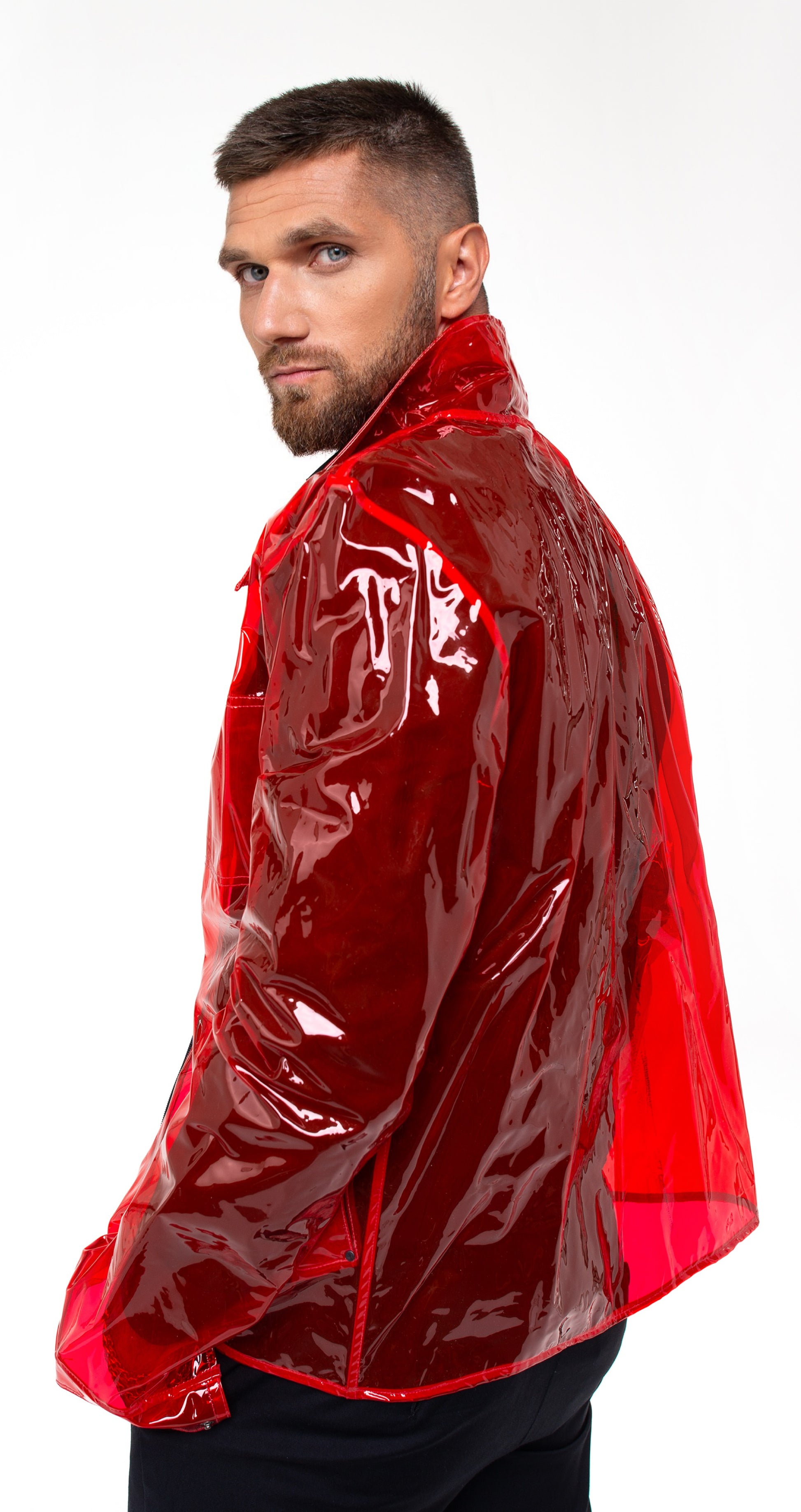 Model wearing a futuristic Red Vinyl Blazer in an urban setting.
