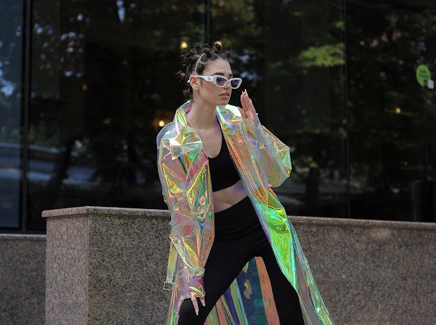 Futuristic longline iridescent jacket from the holographic vinyl trench coat collection.