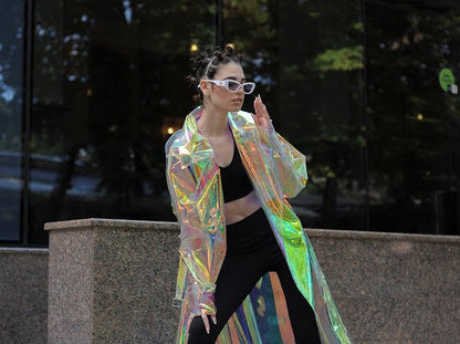 Futuristic longline iridescent jacket from the holographic vinyl trench coat collection.