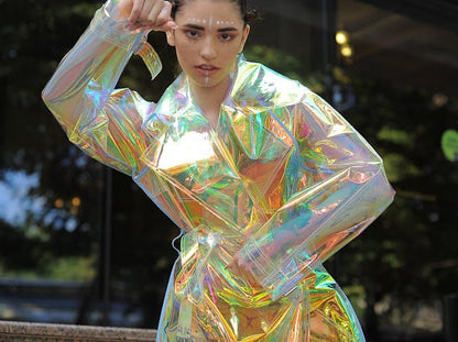 Futuristic longline iridescent jacket from the holographic vinyl trench coat collection.
