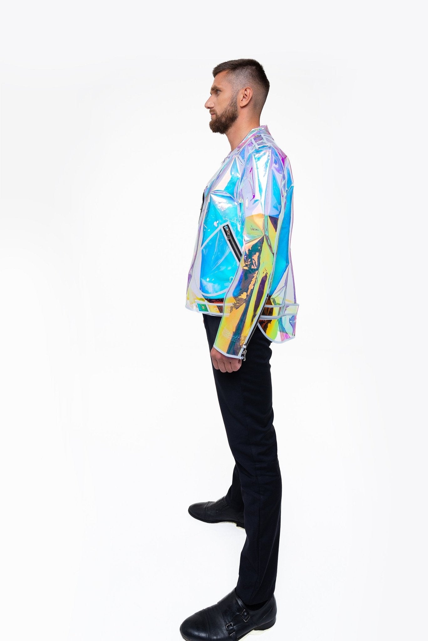 Side profile of the futuristic holographic moto jacket on a masculine frame.