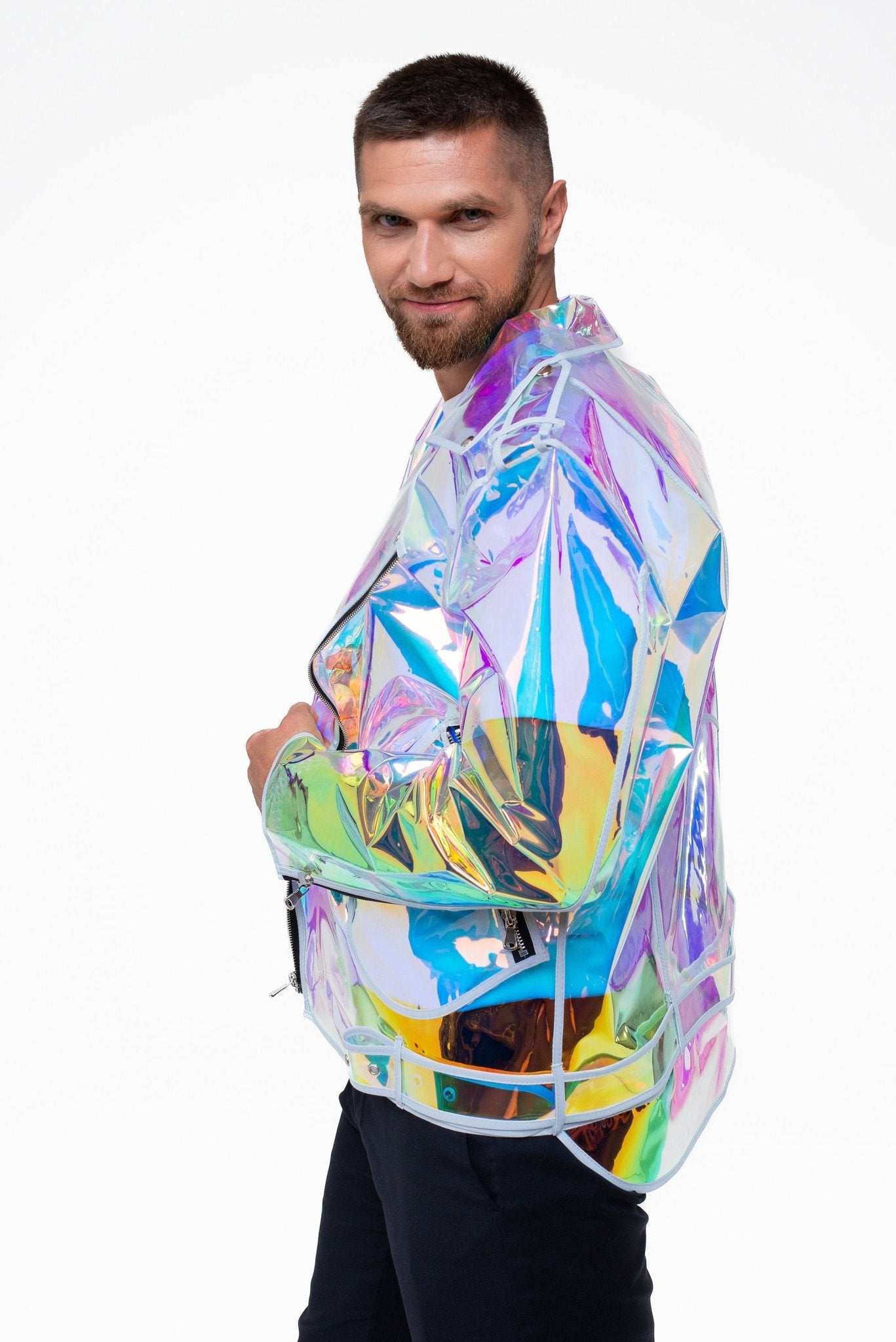 Side profile of the futuristic holographic moto jacket on a masculine frame.