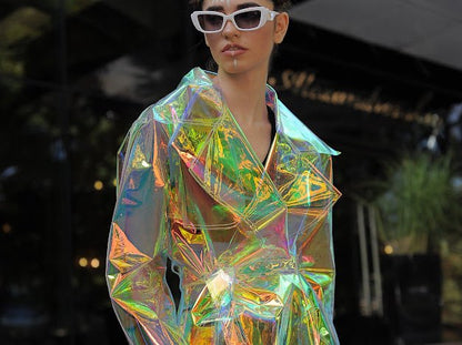 Model wearing the holographic vinyl trench coat iridescent festival outfit by Domdrich.