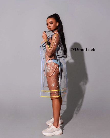 Detailed view of waterproof clear vinyl and vibrant colored piping on a raincoat.