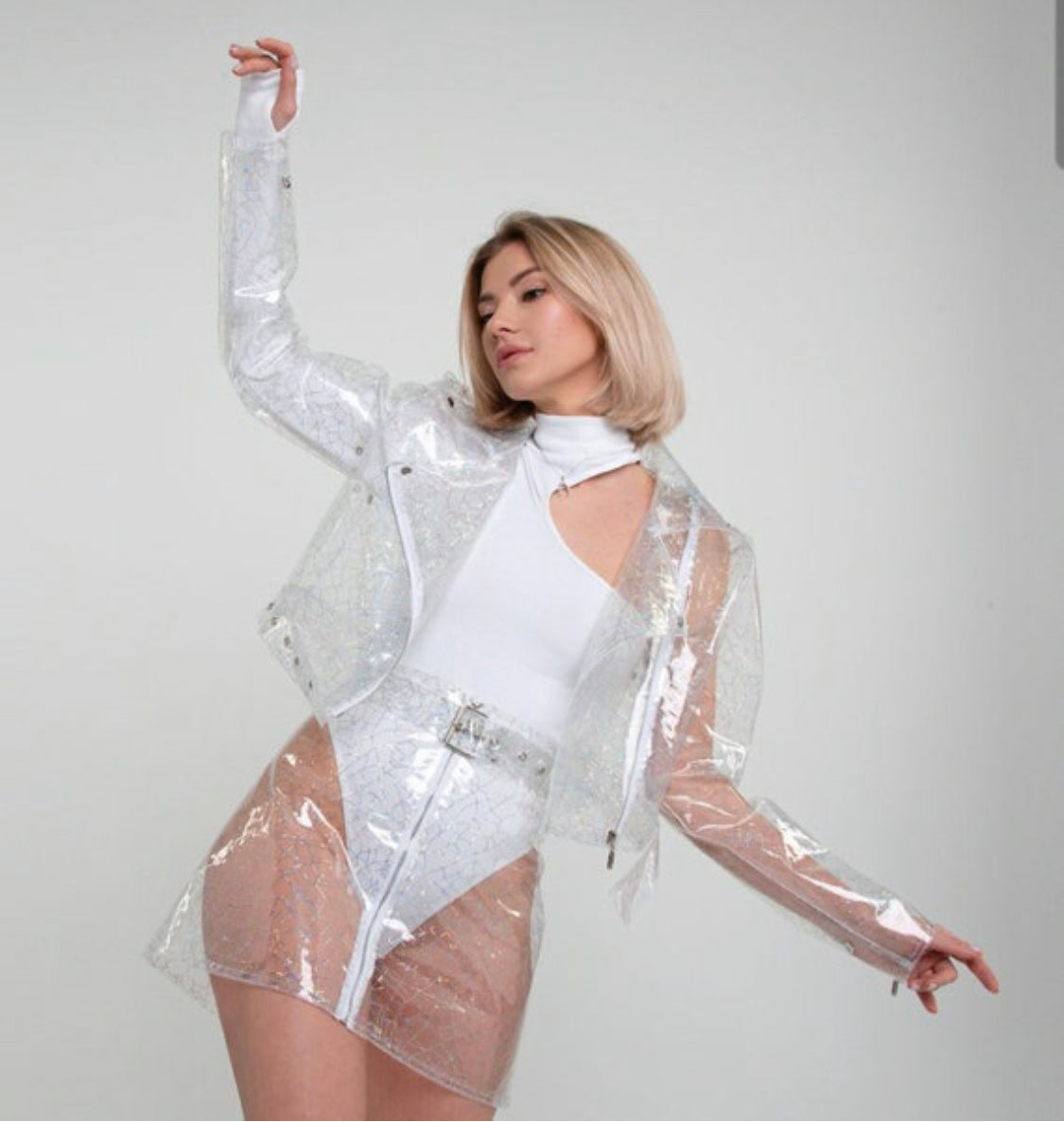 Clear Stylish TPU suit: cropped jacket and the skirt. Transparent vinyl unique clothes. Party clothing.